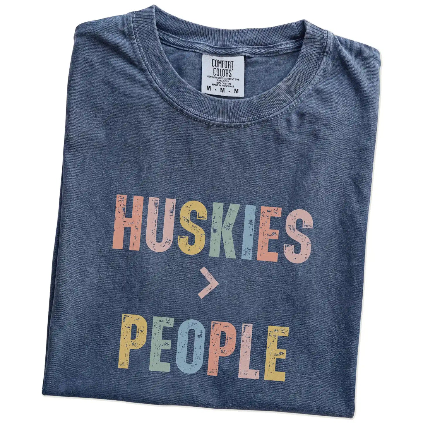 Folded Denim Comfort Colors® T-shirt showing “Huskies > People” text