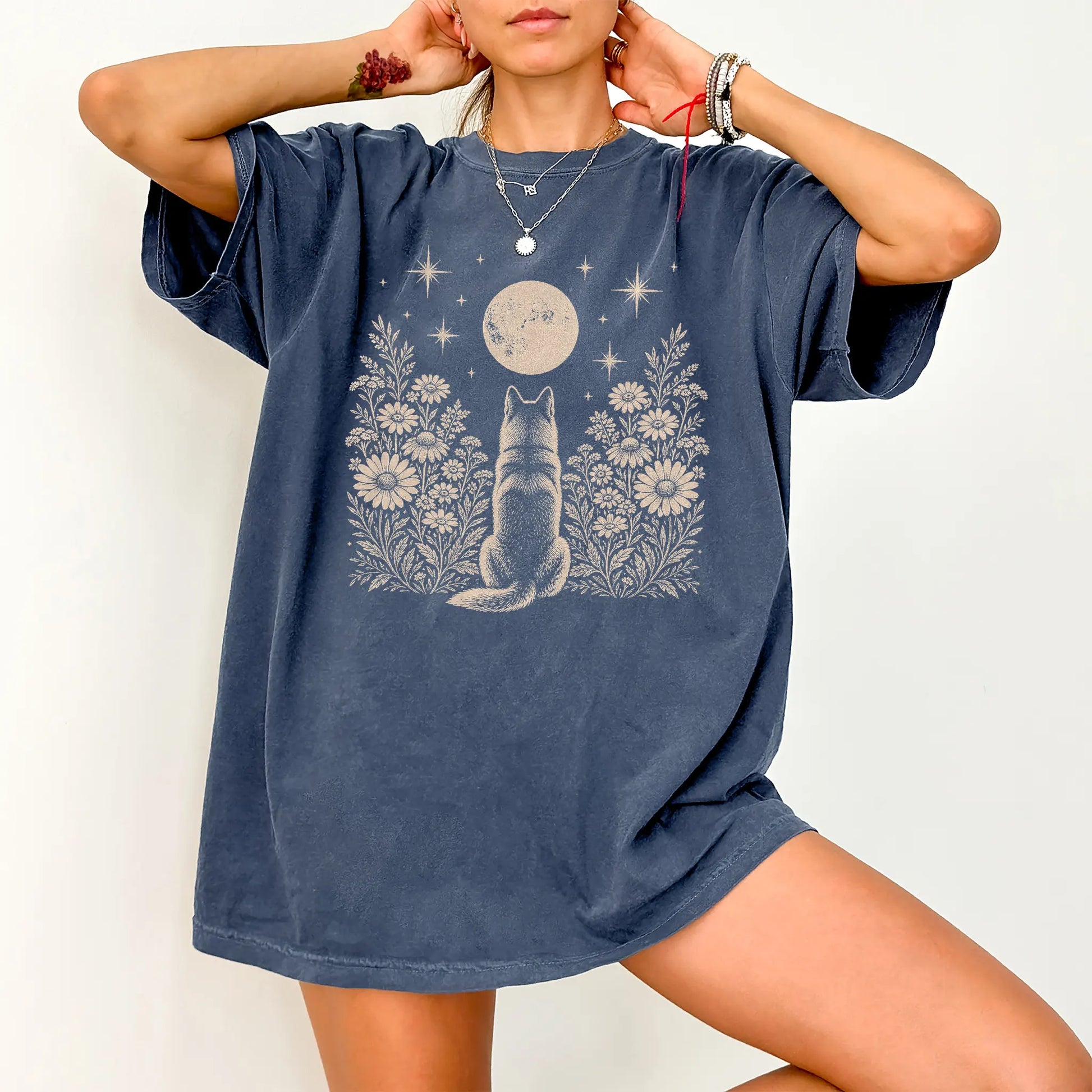 Model wearing a Denim Comfort Colors® T-shirt featuring Husky beneath a wildflower moon