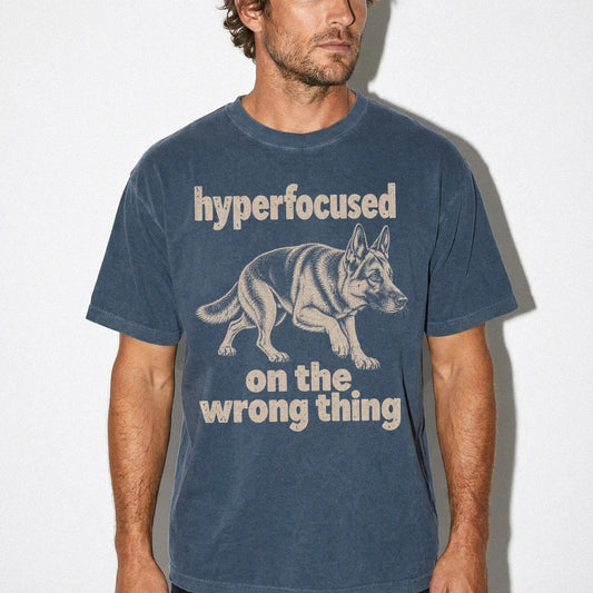 Person wearing a Denim T-shirt with German Shepherd “hyperfocused on the wrong thing” design