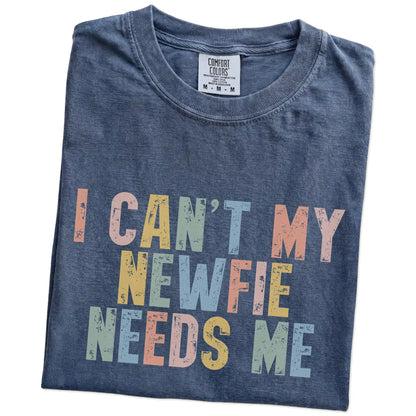 Folded Denim Comfort Colors® T-shirt showing Newfie with “I Can’t, My Dog Needs Me” lettering