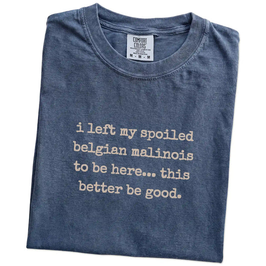 Folded Denim Comfort Colors® T-shirt showing the “I Left My Spoiled Belgian Malinois Home” saying