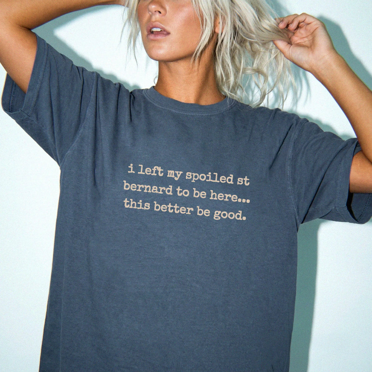 Model wearing a Denim Comfort Colors® T-shirt featuring the “I Left My Spoiled Saint Bernard Home” saying