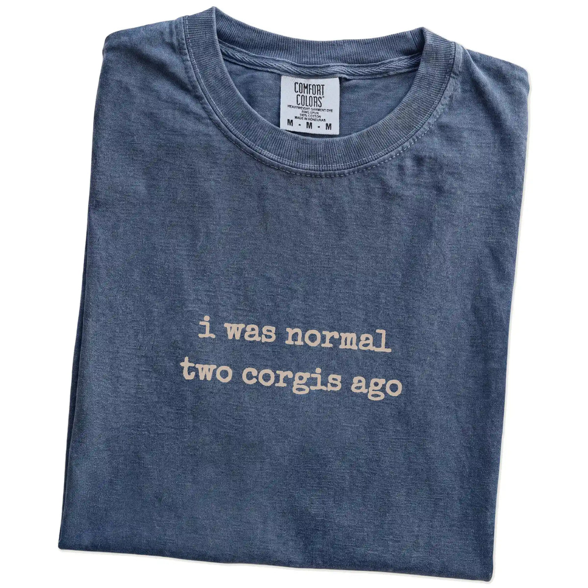 Folded Denim Comfort Colors® T-shirt showing i was normal two corgis ago lettering