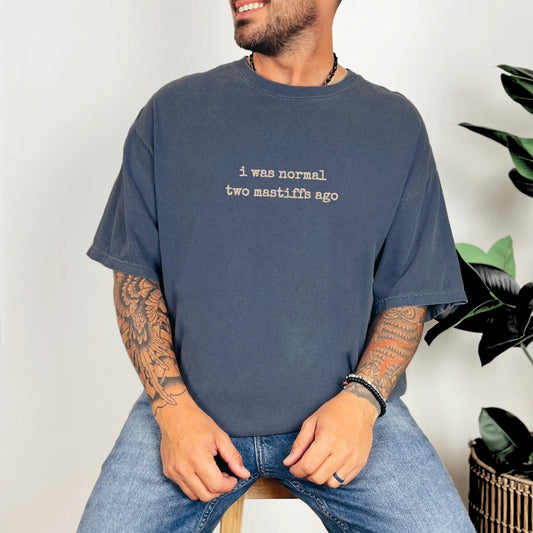 Model wearing a Denim Comfort Colors® T-shirt with i was normal two mastiffs ago lettering