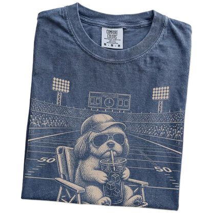 Folded Denim Comfort Colors® T-shirt showing Shih Tzu claiming the football field with “I Live Here Now” lettering