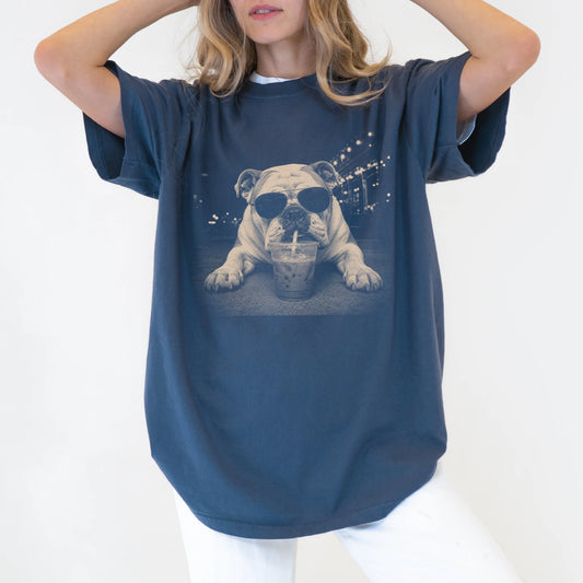 Model wearing a Denim Comfort Colors® T-shirt featuring Bulldog with iced coffee in a retro grunge design