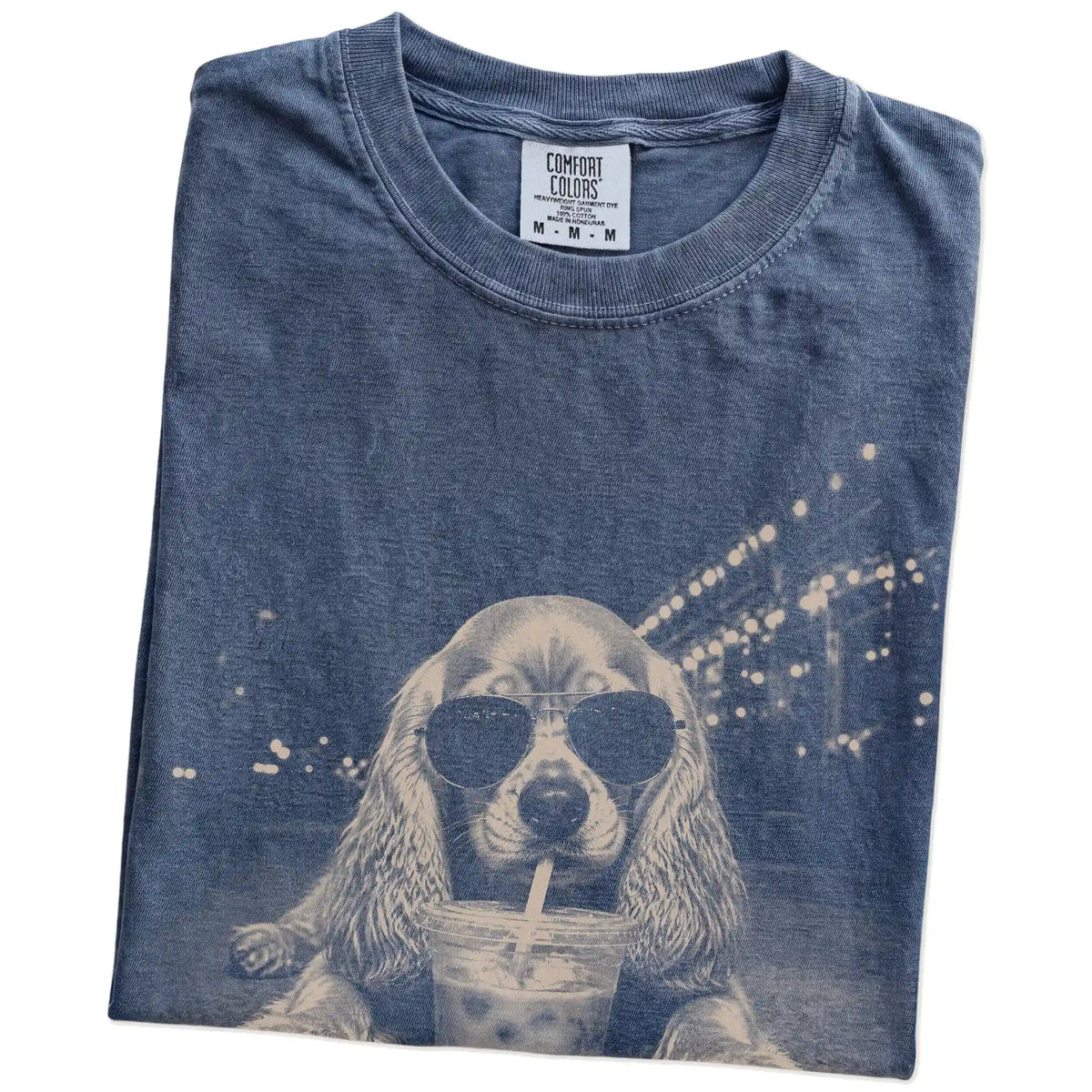 Folded Denim Comfort Colors® T-shirt showing Cocker Spaniel with iced coffee in a retro grunge design