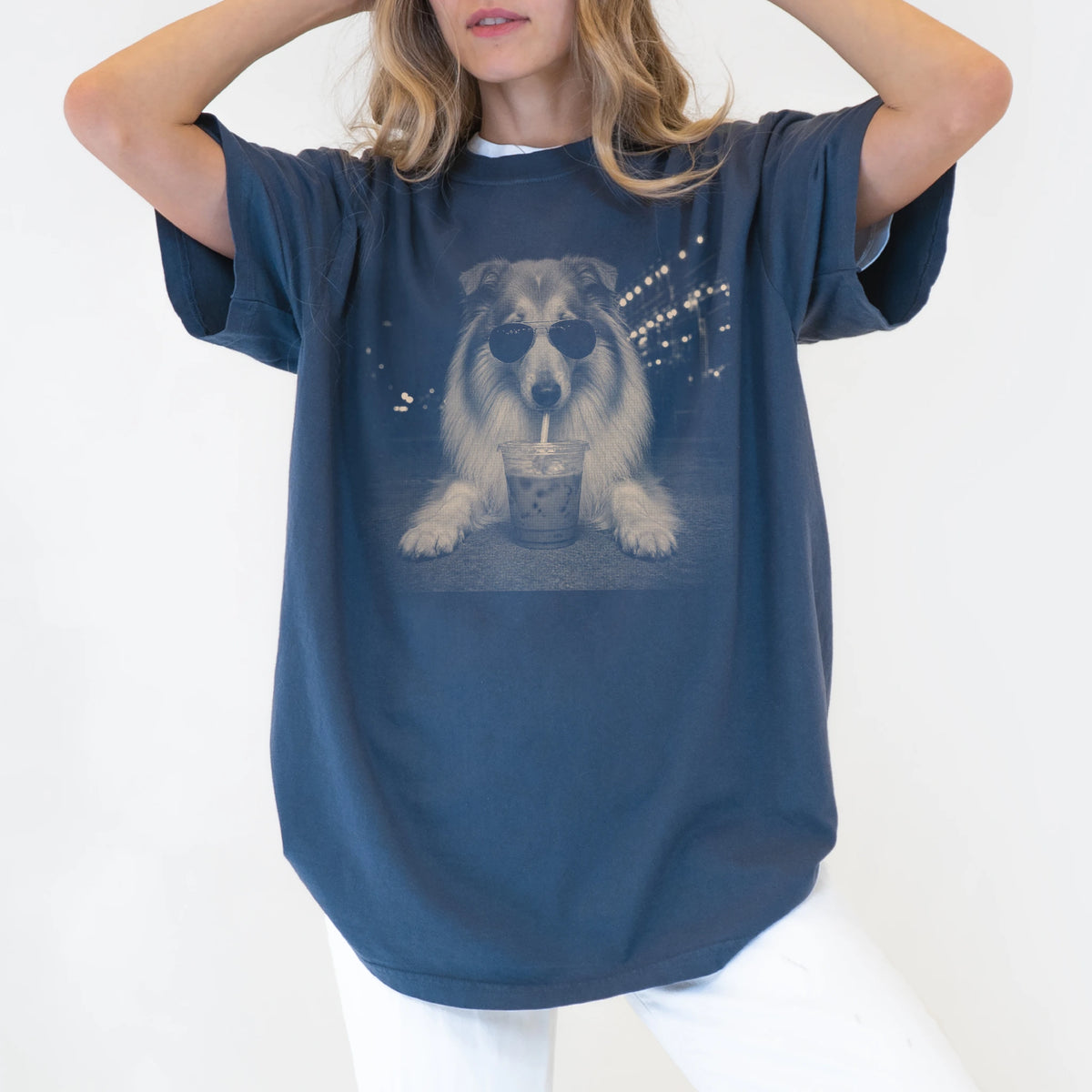 Model wearing a Denim Comfort Colors® T-shirt featuring Collie with iced coffee in a retro grunge design