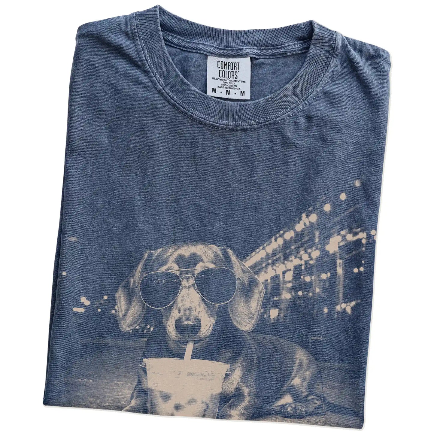 Folded Denim Comfort Colors® T-shirt showing Dachshund with iced coffee in a retro grunge design