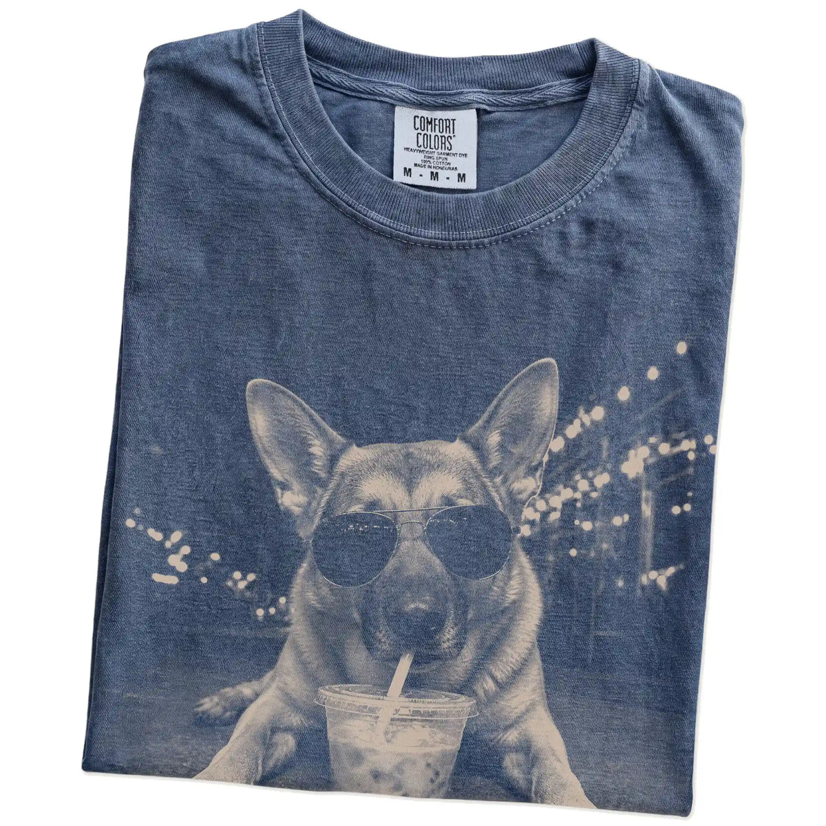Folded Denim Comfort Colors® T-shirt showing German Shepherd with iced coffee in a retro grunge design