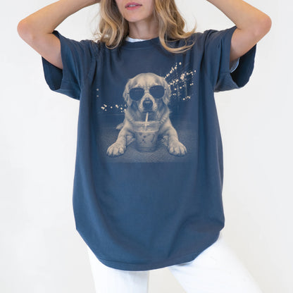 Model wearing a Denim Comfort Colors® T-shirt featuring Golden Retriever with iced coffee in a retro grunge design