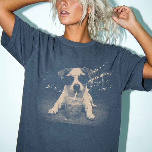 Model wearing a Denim Comfort Colors® T-shirt featuring Jack Russell with iced coffee in a retro grunge design