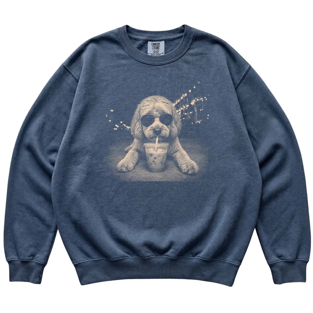 Labradoodle wearing aviator sunglasses and drinking iced coffee on a Denim Comfort Colors 1566 Sweatshirt, flat lay view