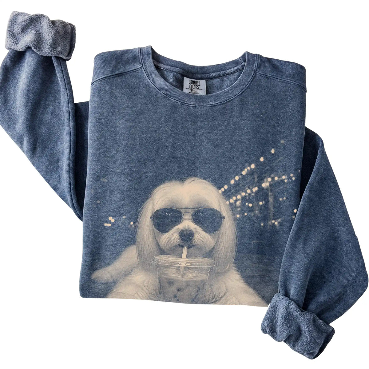 Maltese wearing aviator sunglasses and drinking iced coffee on a Denim Comfort Colors 1566 Sweatshirt, folded view