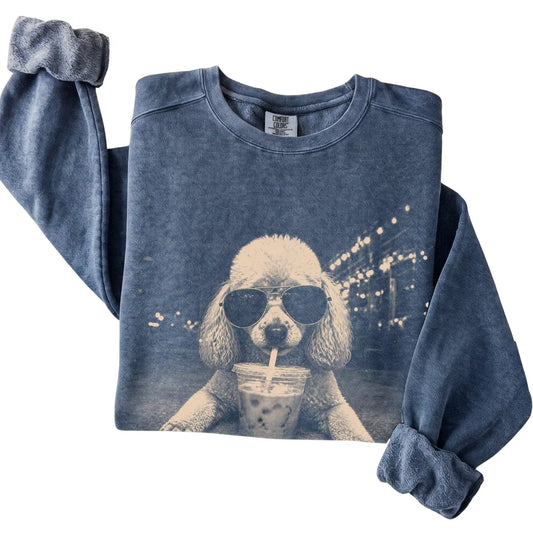 Poodle wearing aviator sunglasses and drinking iced coffee on a Denim Comfort Colors 1566 Sweatshirt, folded view