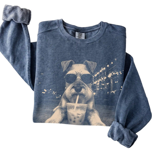 Schnauzer wearing aviator sunglasses and drinking iced coffee on a Denim Comfort Colors 1566 Sweatshirt, folded view