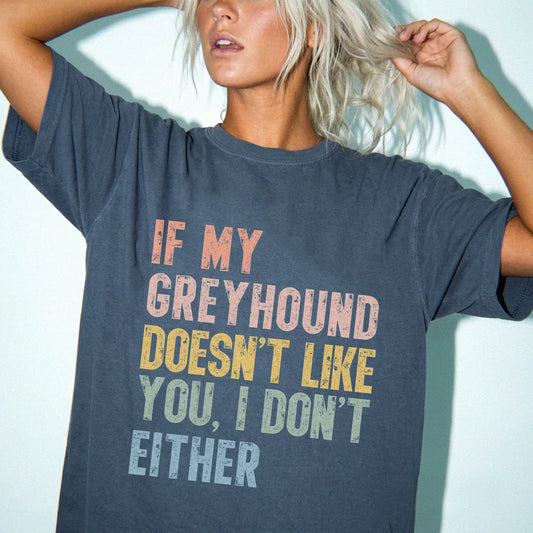 Model wearing a Denim Comfort Colors® T-shirt featuring Greyhound with “If My Dog Doesn’t Like You, I Don’t Either” lettering