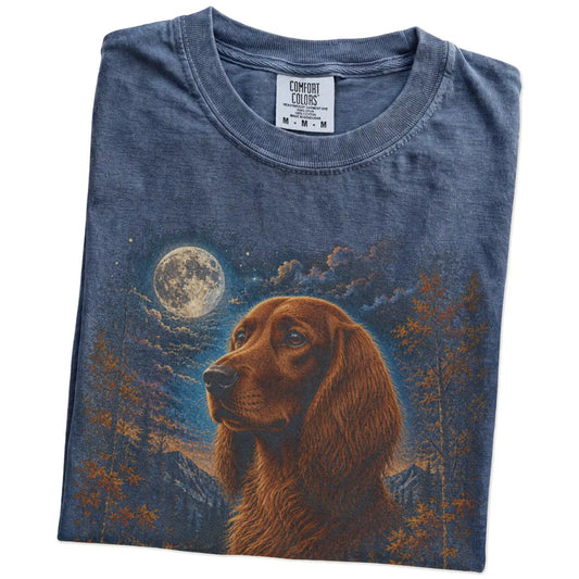 Folded denim T-shirt with Irish Setter Autumn Moon artwork.
