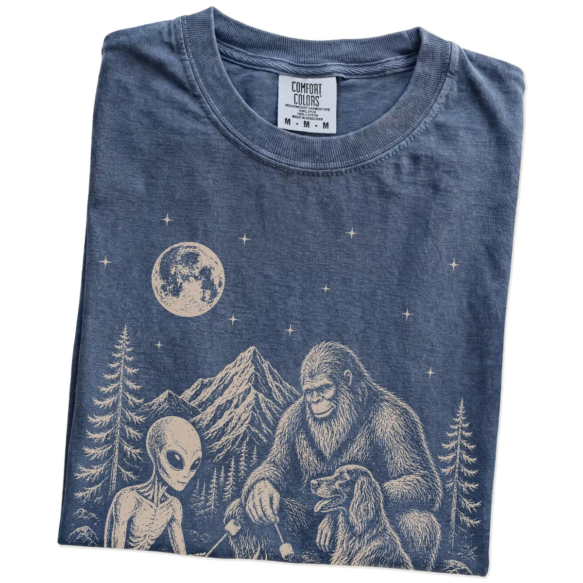 Folded Denim Comfort Colors® T-shirt showing Irish Setter camping with Bigfoot and an alien