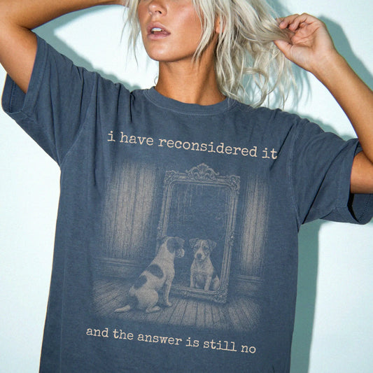 Model wearing a Denim Comfort Colors® T-shirt with “the answer is still no” jack russell design