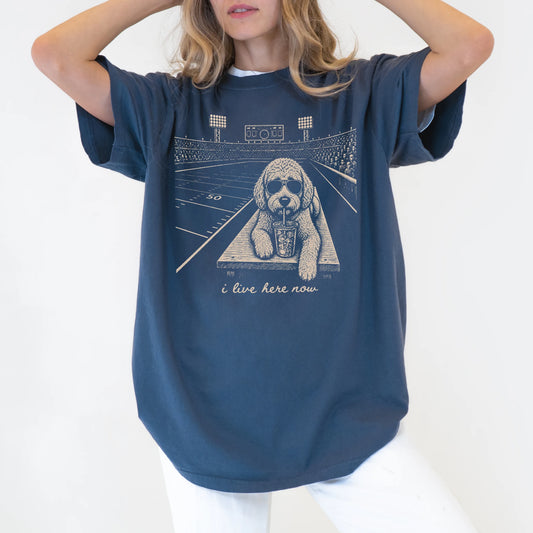 Model wearing a Denim Comfort Colors® T-shirt featuring Labradoodle ready for football and tailgate season