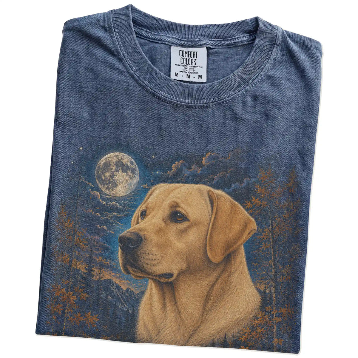 Folded denim T-shirt with Labrador Retriever Autumn Moon artwork.