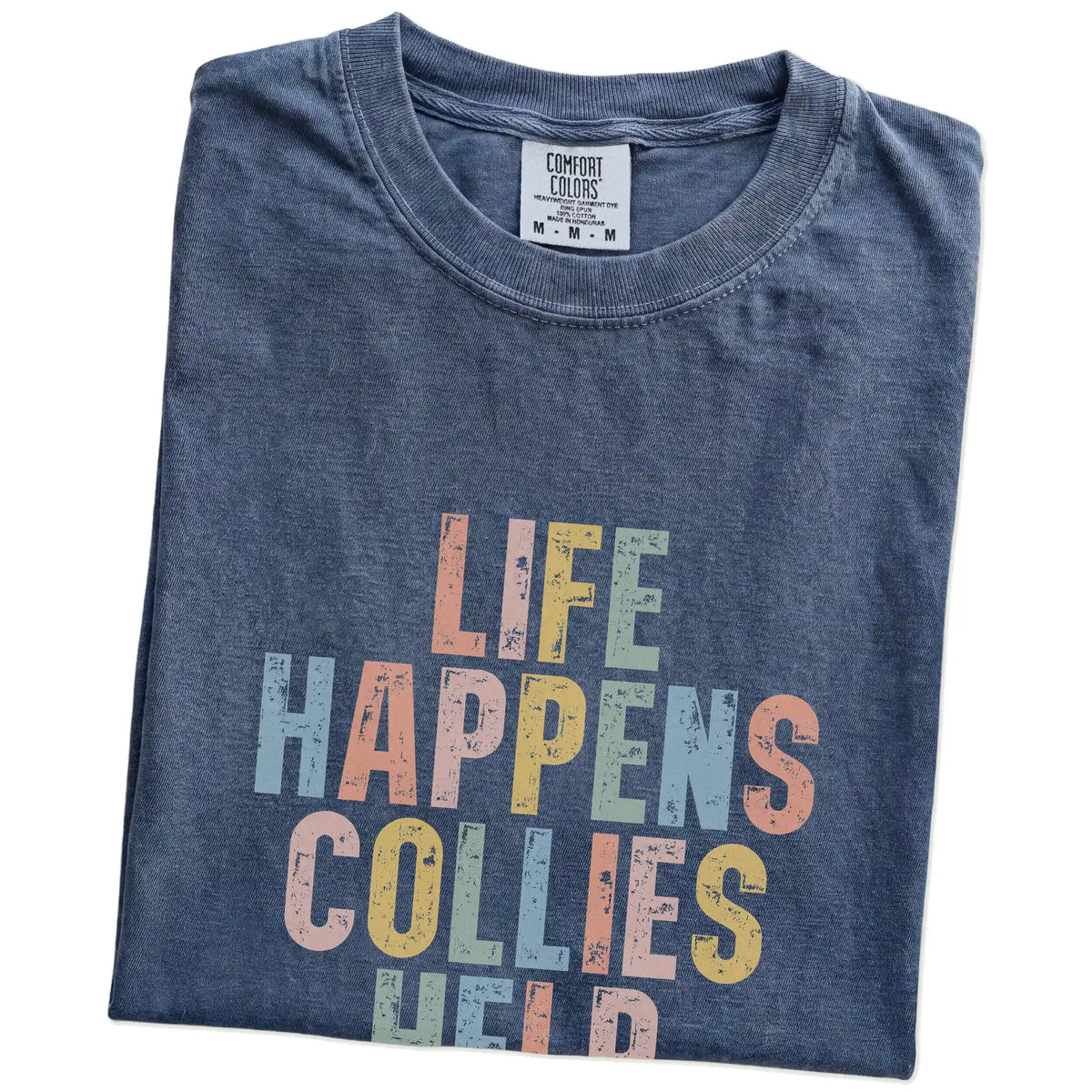Folded Denim Comfort Colors® T-shirt showing Collie making hard days better with “Life Happens, Dogs Help” lettering