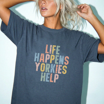 Model wearing a Denim Comfort Colors® T-shirt with retro “Life Happens, Yorkies Help” lettering