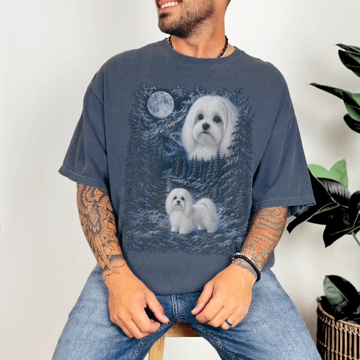 Person wearing a Denim Maltese winter forest t-shirt