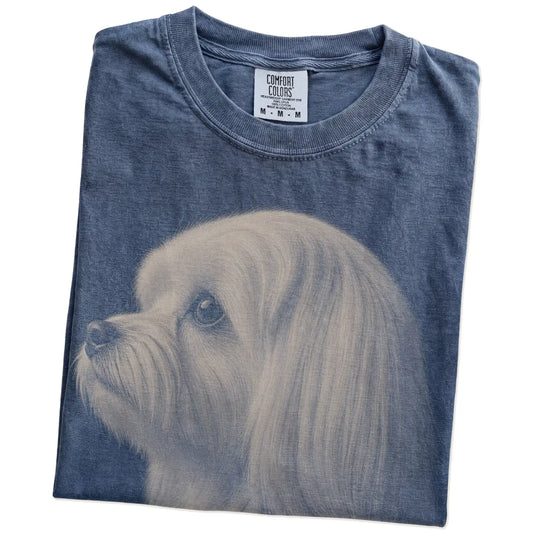 Folded Denim Comfort Colors® T-shirt showing a detailed photographic portrait of a Maltese