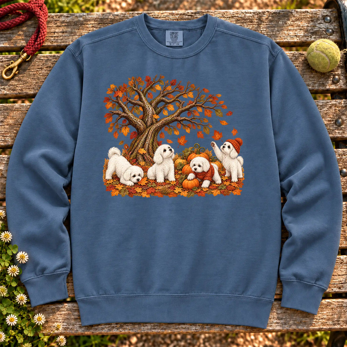 Four Maltese puppies with pumpkins beneath an autumn tree on a Denim garment-dyed sweatshirt
