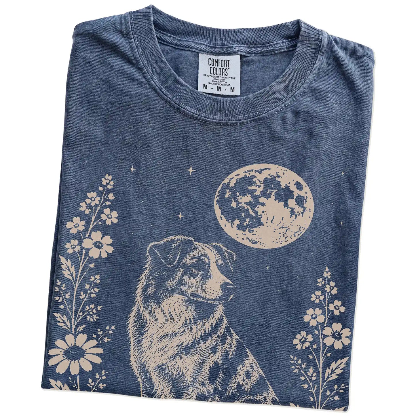 Folded Denim Comfort Colors® T-shirt showing Australian Shepherd framed by flowers beneath the moon
