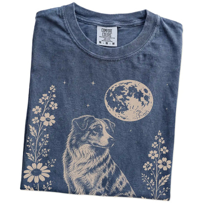 Folded Denim Comfort Colors® T-shirt showing Australian Shepherd framed by flowers beneath the moon