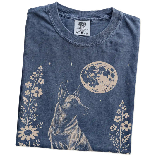 Folded Denim Comfort Colors® T-shirt showing Belgian Malinois framed by flowers beneath the moon