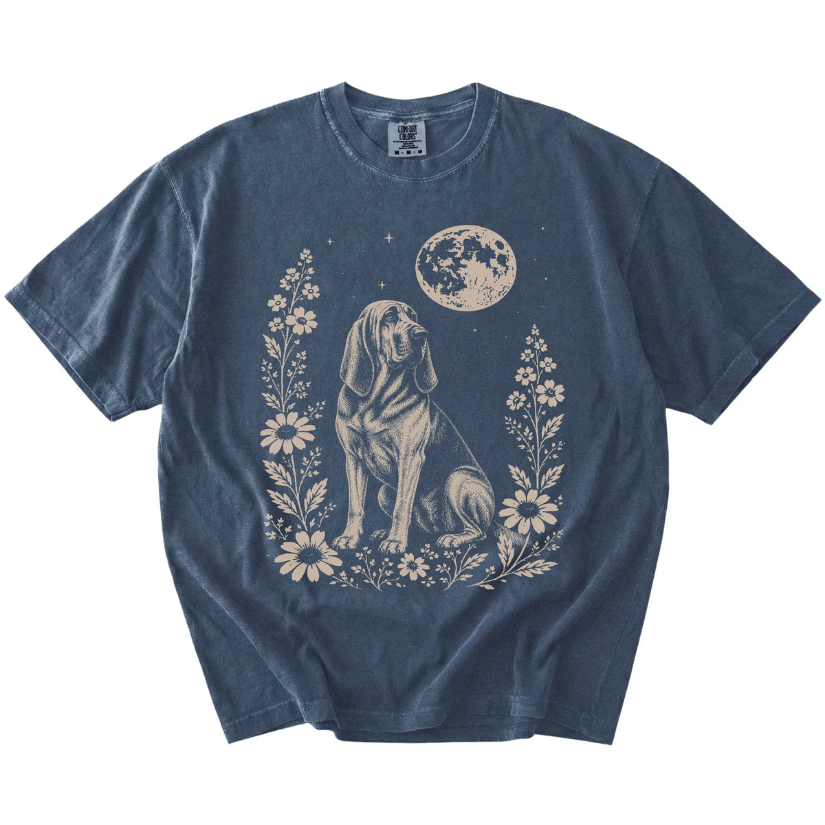 Bloodhound framed by flowers beneath the moon on a Denim Comfort Colors® T-shirt