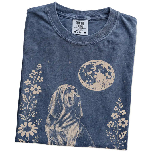 Folded Denim Comfort Colors® T-shirt showing Bloodhound framed by flowers beneath the moon