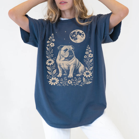 Model wearing a Denim Comfort Colors® T-shirt featuring Bulldog framed by flowers beneath the moon