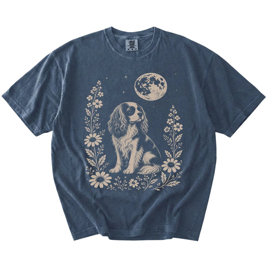 Cavalier King Charles Spaniel framed by flowers beneath the moon on a Denim Comfort Colors® T-shirt
