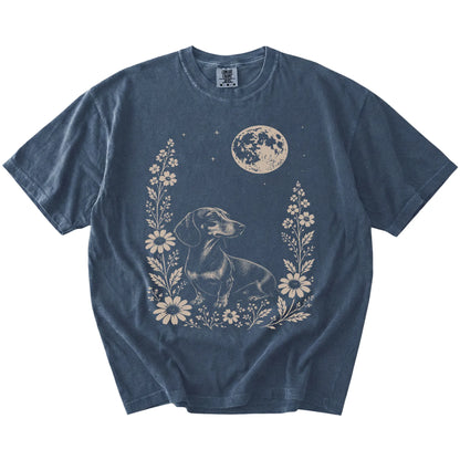Dachshund framed by flowers beneath the moon on a Denim Comfort Colors® T-shirt