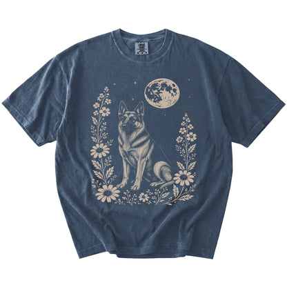 German Shepherd framed by flowers beneath the moon on a Denim Comfort Colors® T-shirt