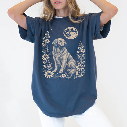 Model wearing a Denim Comfort Colors® T-shirt featuring Golden Retriever framed by flowers beneath the moon
