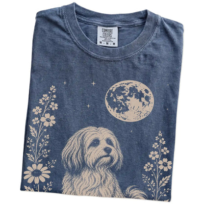 Folded Denim Comfort Colors® T-shirt showing Havanese framed by flowers beneath the moon