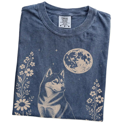 Folded Denim Comfort Colors® T-shirt showing Husky framed by flowers beneath the moon