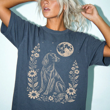 Model wearing a Denim Comfort Colors® T-shirt featuring Irish Setter framed by flowers beneath the moon