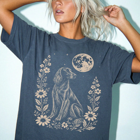 Model wearing a Denim Comfort Colors® T-shirt featuring Irish Setter framed by flowers beneath the moon