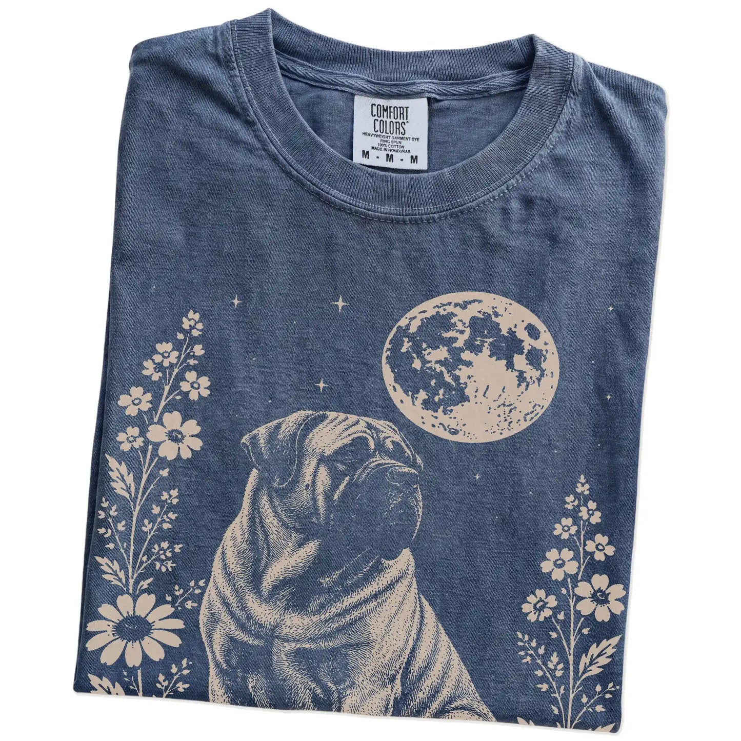 Folded Denim Comfort Colors® T-shirt showing Mastiff framed by flowers beneath the moon
