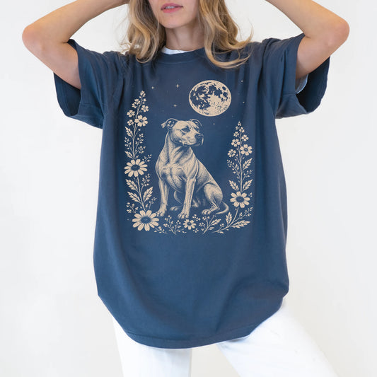 Model wearing a Denim Comfort Colors® T-shirt featuring Pitbull framed by flowers beneath the moon