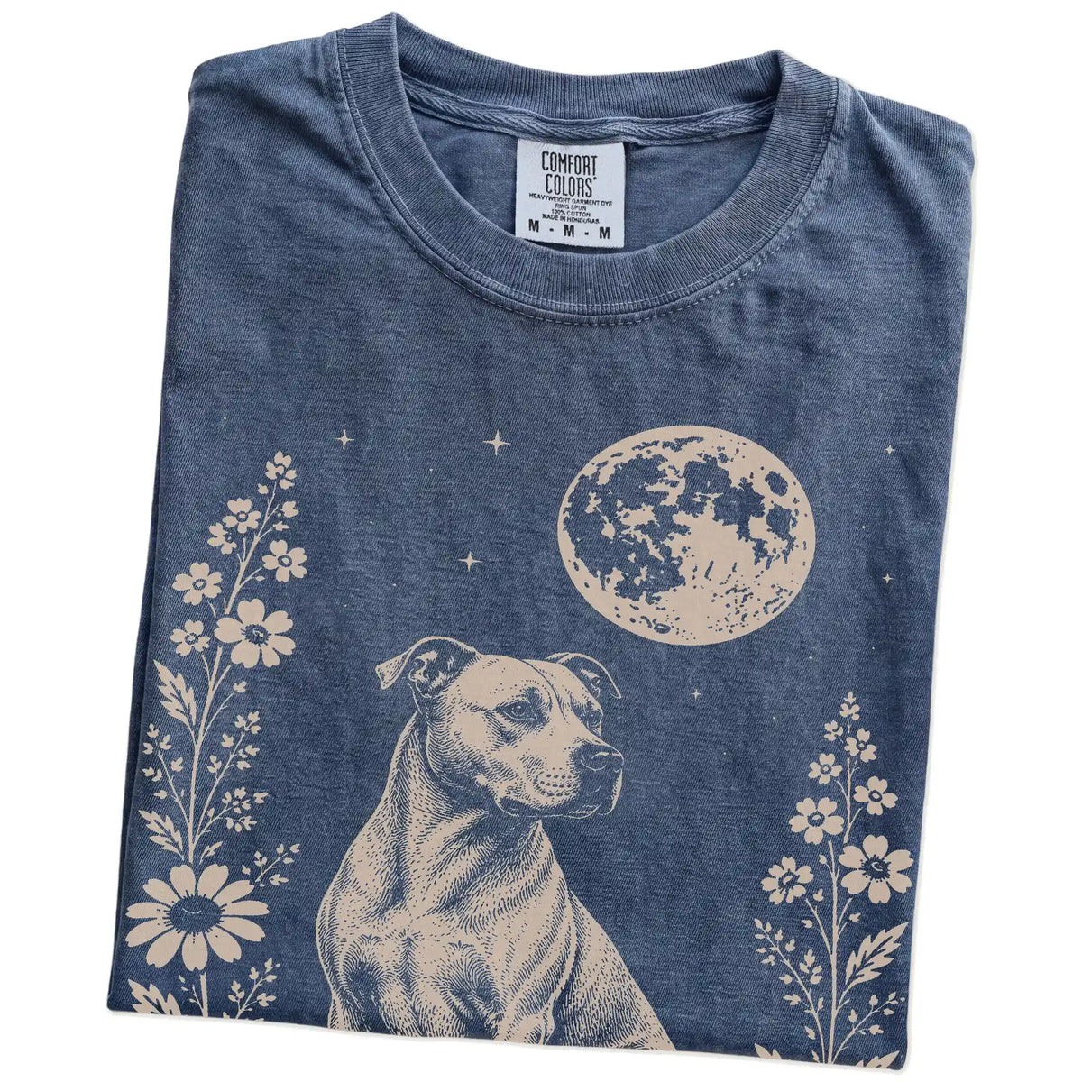 Folded Denim Comfort Colors® T-shirt showing Pitbull framed by flowers beneath the moon