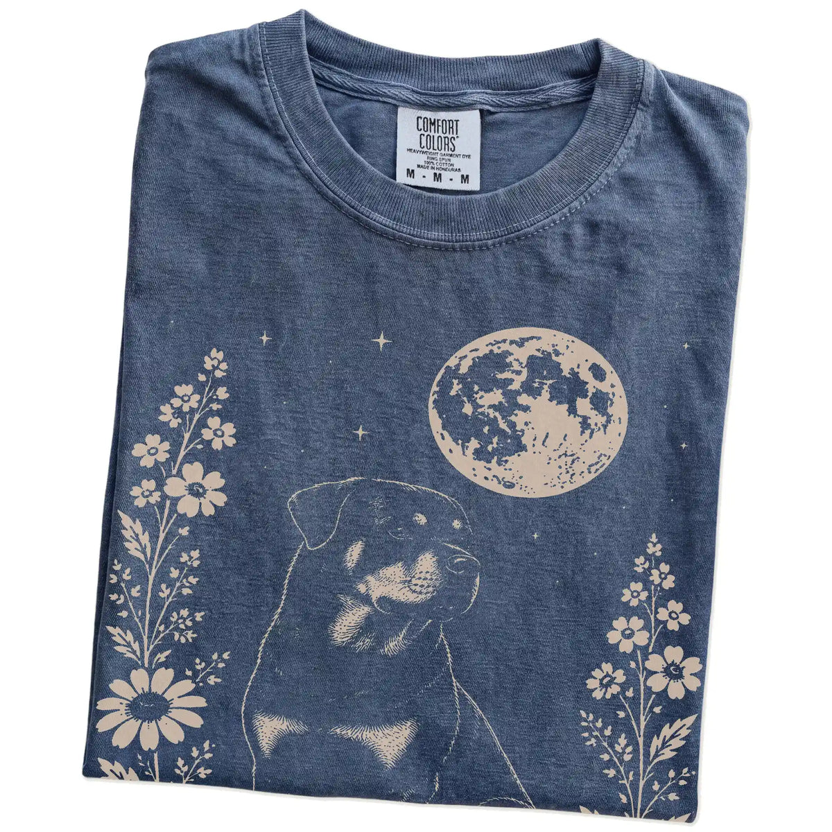 Folded Denim Comfort Colors® T-shirt showing Rottweiler framed by flowers beneath the moon