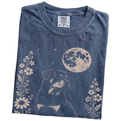 Folded Denim Comfort Colors® T-shirt showing Rottweiler framed by flowers beneath the moon